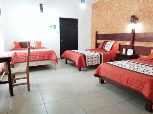 Кровать или кровати в номере Kali Huasteca Posada