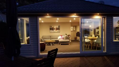 a living room with a couch and a table at Selah Retreat in Nelson