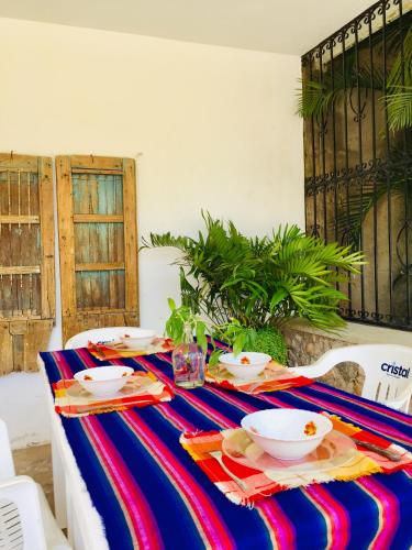 a table with bowls and plates of food on it at Casa de Ines y Victoria in Valladolid