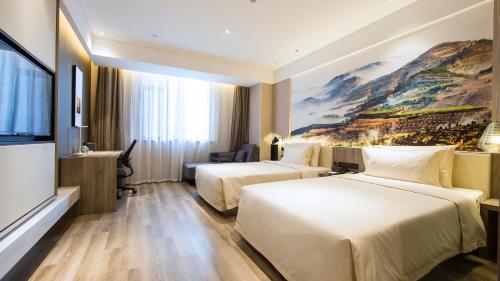 Katil atau katil-katil dalam bilik di Atour Hotel (Houma Xintian Square)