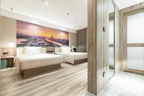Atour Hotel (Wuhan Mulan Pishang Building)にあるベッド