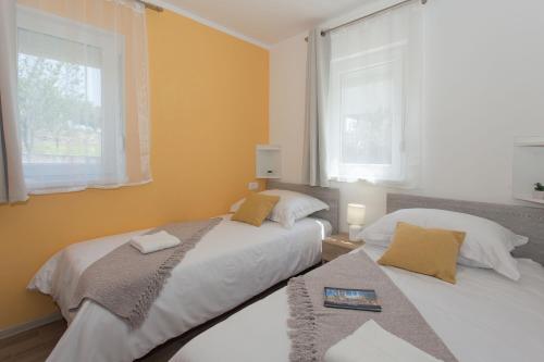 Postel nebo postele na pokoji v ubytování Villa Honey