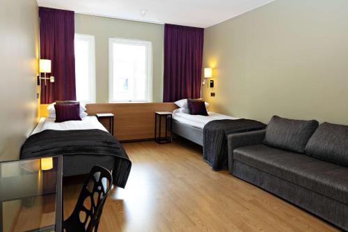 Sure Hotel by Best Western Arena tesisinde bir odada yatak veya yataklar