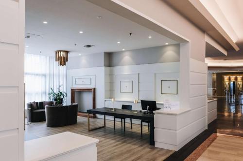 an office with a desk in the middle of a room at Best Western CTC Hotel Verona in San Giovanni Lupatoto