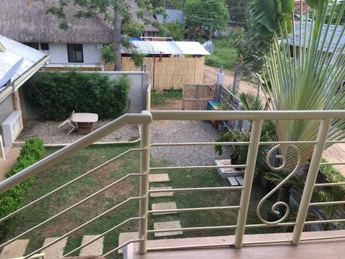 a view of a garden from a balcony at John Verhel Homes in Panglao