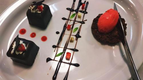 a plate of desserts on a white plate at Olympos Beach in Plaka Litochorou