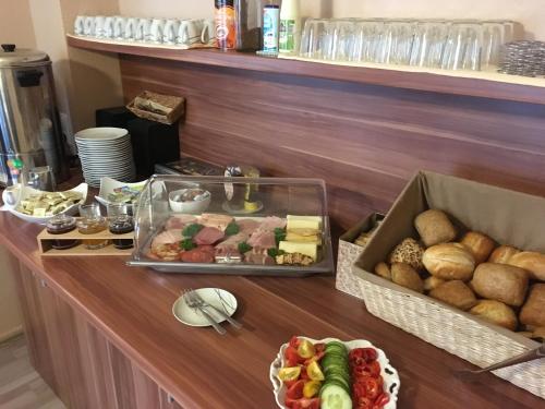 a buffet with different types of food on a table at Pension No. 55 in Erfurt