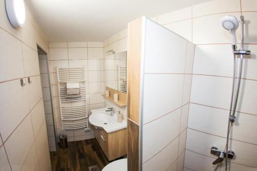 a bathroom with a toilet and a sink at STUDIO LUNA in Bled