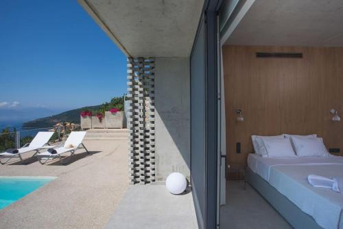 Ένα ή περισσότερα κρεβάτια σε δωμάτιο στο Villa Fyki
