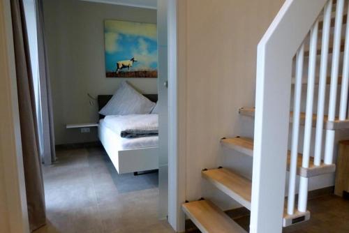 Ein Bett oder Betten in einem Zimmer der Unterkunft Apartment Watt´n Glück, Am Alten Deich 26 (Parkplatz 92)