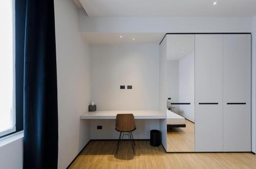 a small kitchen with a desk and a chair at Piranesi 246 in Milan