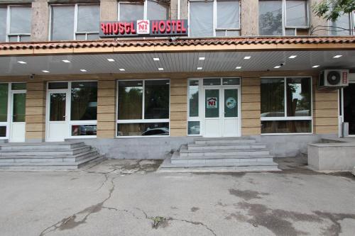 a building with a sign on the front of it at HOTEL N1 in Yerevan