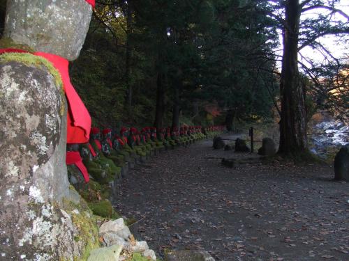 a row of chairs sitting on top of a rock at Nikko Pension L'escale in Nikko