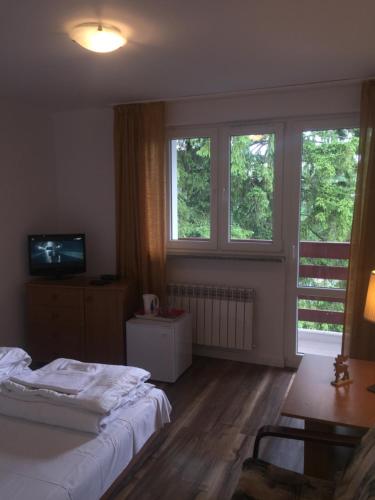 Postel nebo postele na pokoji v ubytování Willa MARANT