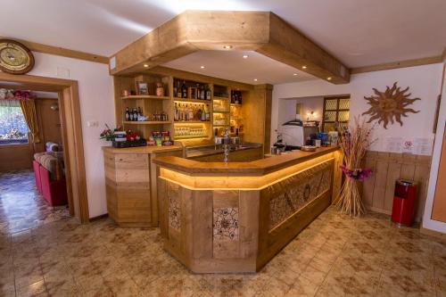 a kitchen with a large island in a room at Hotel Siera Hof in Sappada