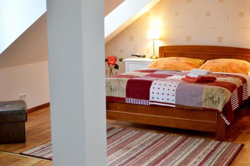 a bedroom with a bed in a attic at Penzion Daniela in Rajecké Teplice