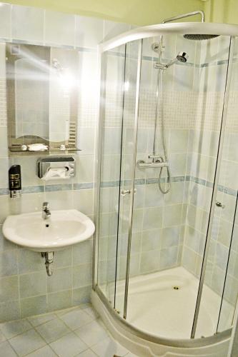 a bathroom with a shower and a sink at Penzion Daniela in Rajecké Teplice
