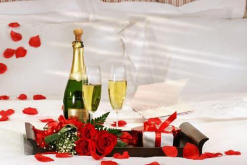 a bottle of champagne and two glasses of wine at Saint George Hotel in Rodakino