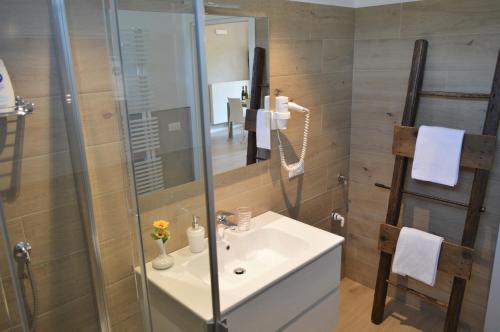 a bathroom with a sink and a shower at Casa Mamma Pina in Arco