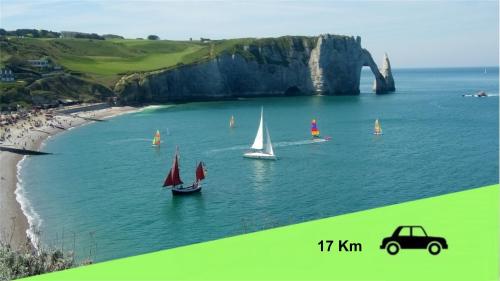 a group of boats in the water near a beach at Jacuzzi Romantique 15 min Etretat 1 in Fécamp