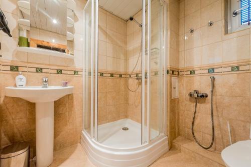 a bathroom with a shower and a sink at Cozy beach apartment in Pärnu