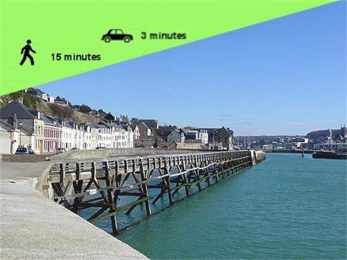 a bridge over the water with a car on it at Jacuzzi Romantique 15 min Etretat 1 in Fécamp