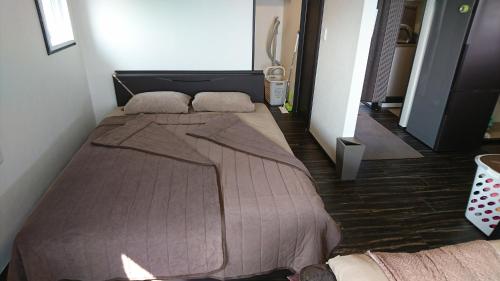 a bedroom with a large bed in a room at VACANCE club in Ishigaki Island