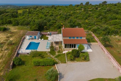 an aerial view of a house with a swimming pool at Villa Tanga in Rovinj