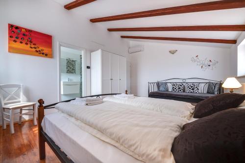 Cama o camas de una habitación en Villa Tanga