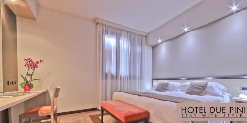 Postel nebo postele na pokoji v ubytování Hotel Due Pini
