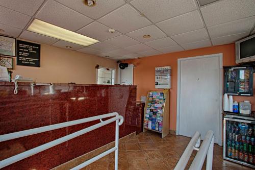 a fast food restaurant with a counter and a grocery store at Economy Motel Inn and Suites Somers Point in Somers Point