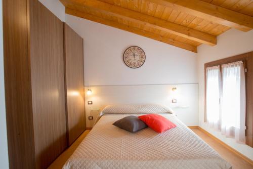 a bedroom with a bed with two pillows on it at Bed and Breakfast La Quiete in Arcugnano