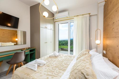 Postel nebo postele na pokoji v ubytování Vigla Suites
