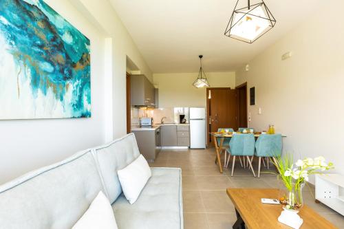 a living room with a couch and a table at Vigla Suites in Rethymno Town