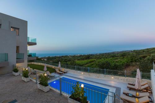 a view of a swimming pool on a building at Vigla Suites in Rethymno Town
