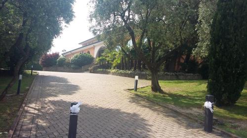 a cobblestone street in front of a house at Villa Del Poeta in Arqua Petrarca