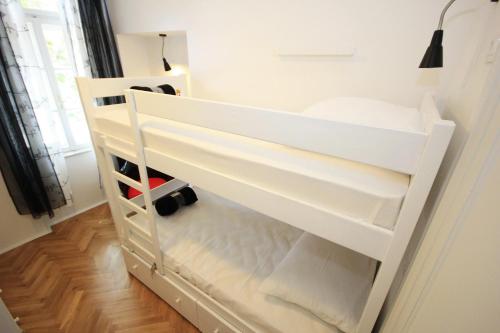 a white bunk bed in a room at The Hostel in Zadar