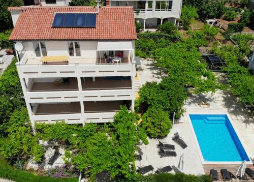 an aerial view of a house with a swimming pool at Apartment Petrinic V in Pula