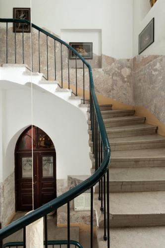 a set of stairs in a building with a door at Laitse castle in Laitse