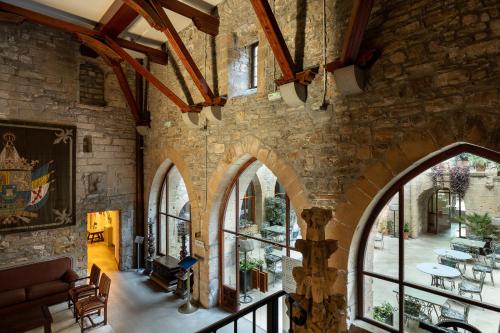 an archway in a stone building with windows at Parador de Hondarribia in Hondarribia