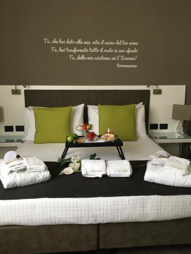 Кровать или кровати в номере L`essenza B&B