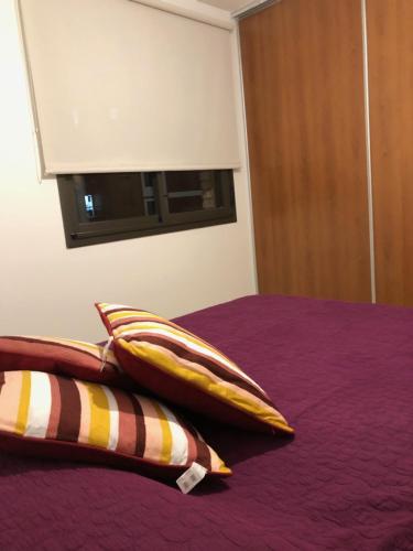Una cama o camas en una habitación de Departamento Parana