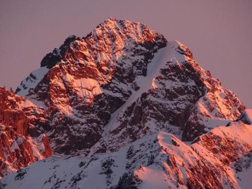 a view of a snow covered mountain at Der Berghof in Hirschegg