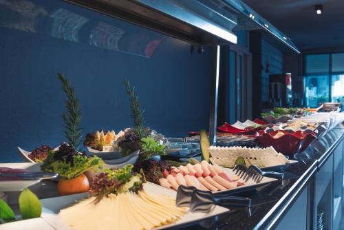 a buffet line with many plates of food at Hotel Karbel Sun in Oludeniz