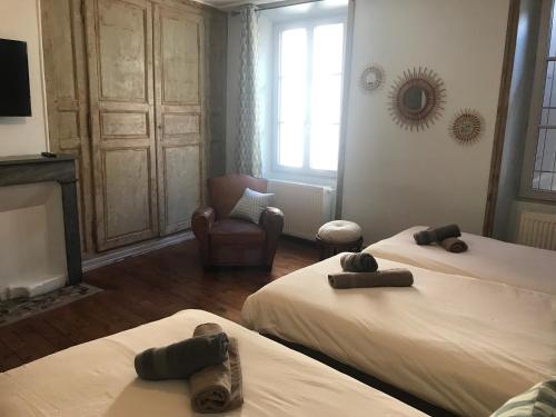 Gîte le pied du géant - Local sécurisé pour les vélosにあるベッド