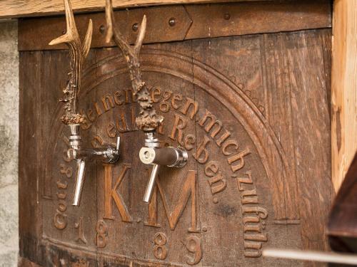 a wooden door with a sign on it at Chalet Piz da Peres in Valdaora