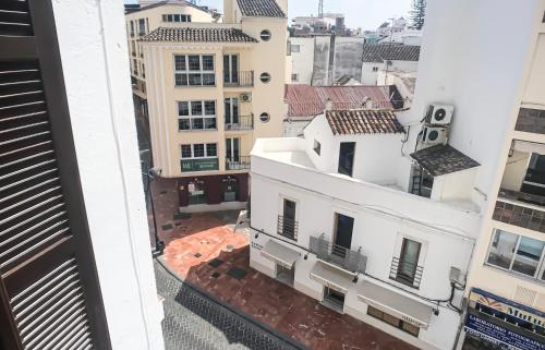 an aerial view of the city from a building at Royal Suites Estepona by Croma in Estepona