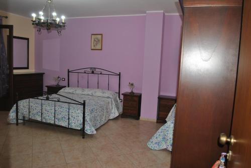 Ένα ή περισσότερα κρεβάτια σε δωμάτιο στο B&B Ippocampo
