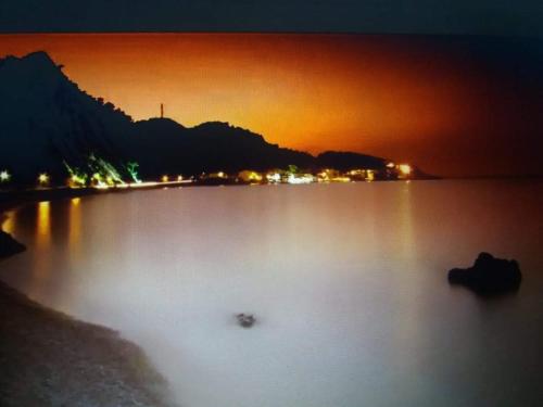 a view of a large lake at night at Abeas Samos Antonis 3 in Samos