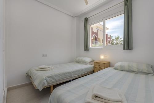 Ліжко або ліжка в номері Isla del Baron - A Murcia Holiday Rentals Property